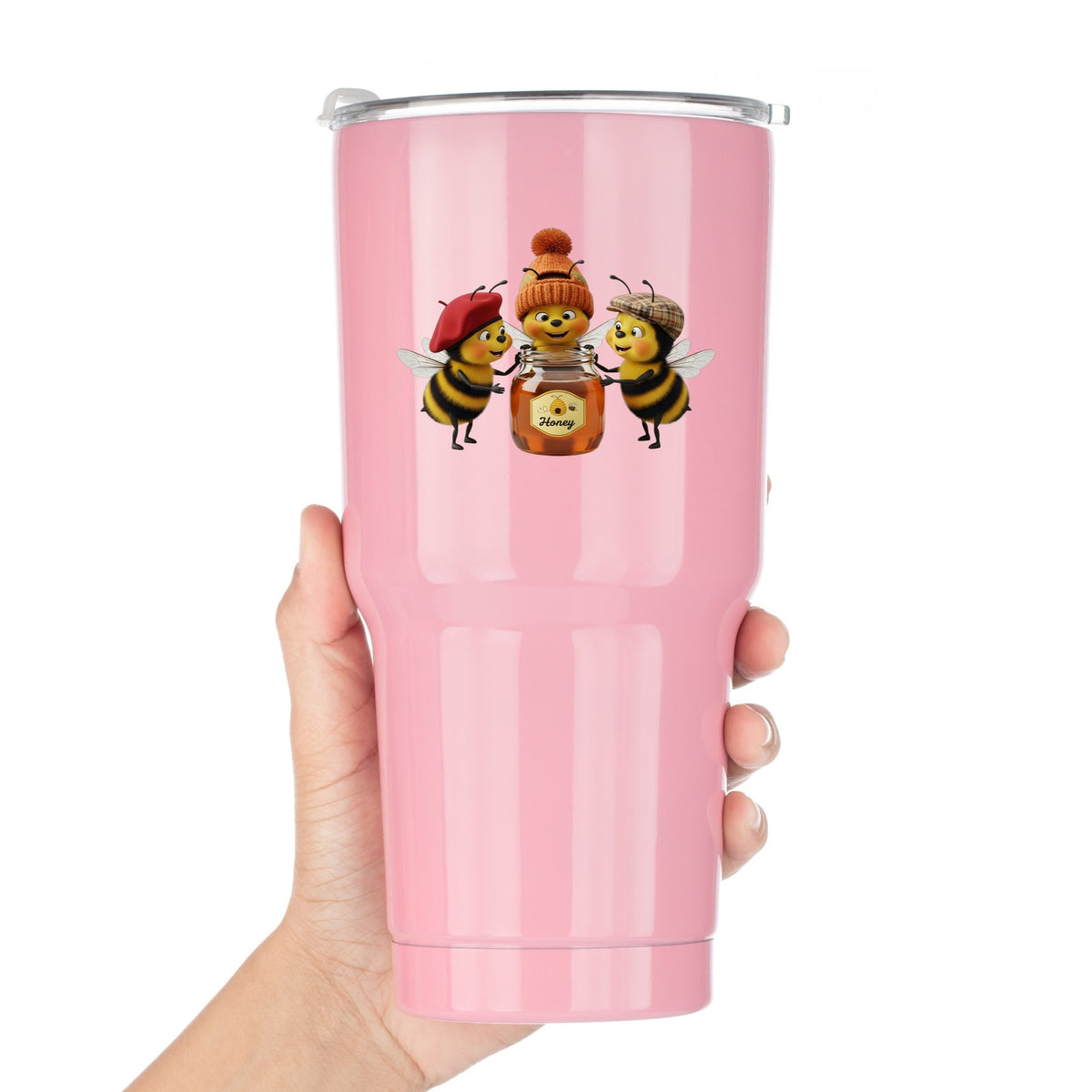 Three Bees With Honey Jar UV DTF sticker applied to a pink tumbler held against a white background