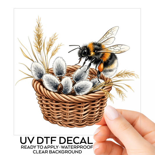 Bumble Bee On Basket Of Pussy Willow UV DTF sticker on its backing card, held in hand