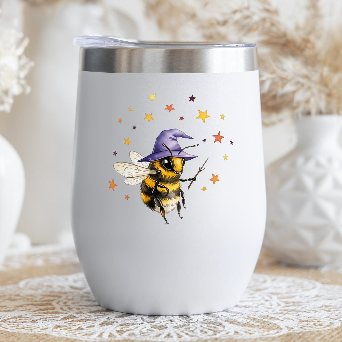 Bee Wizard With Stars UV DTF sticker applied to a white stemless tumbler with a lid