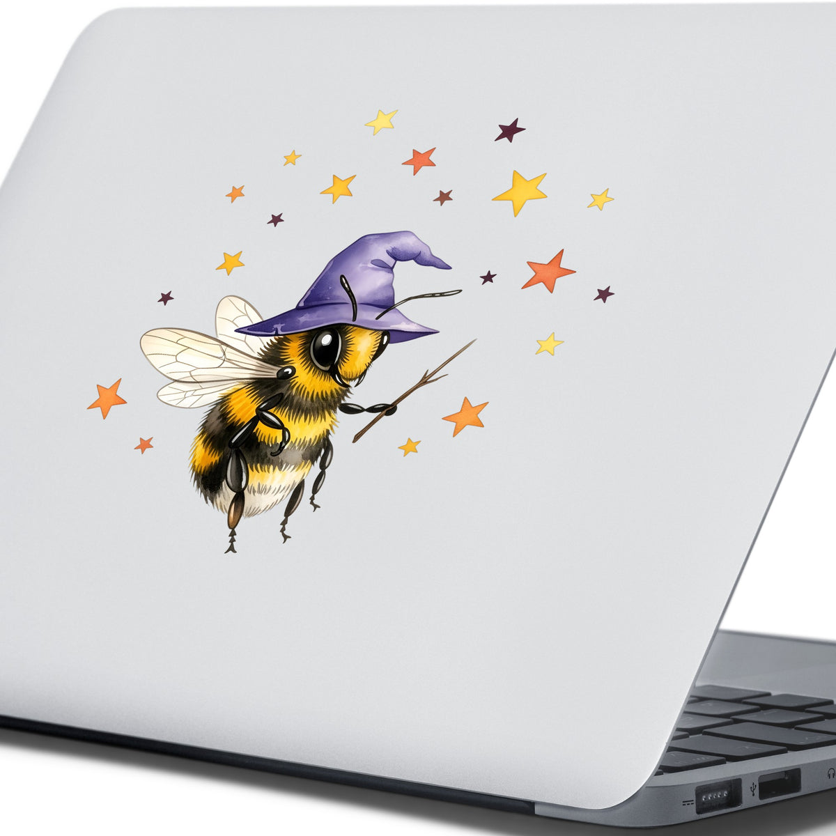 Bee Wizard With Stars UV DTF sticker applied to the lid of a silver laptop