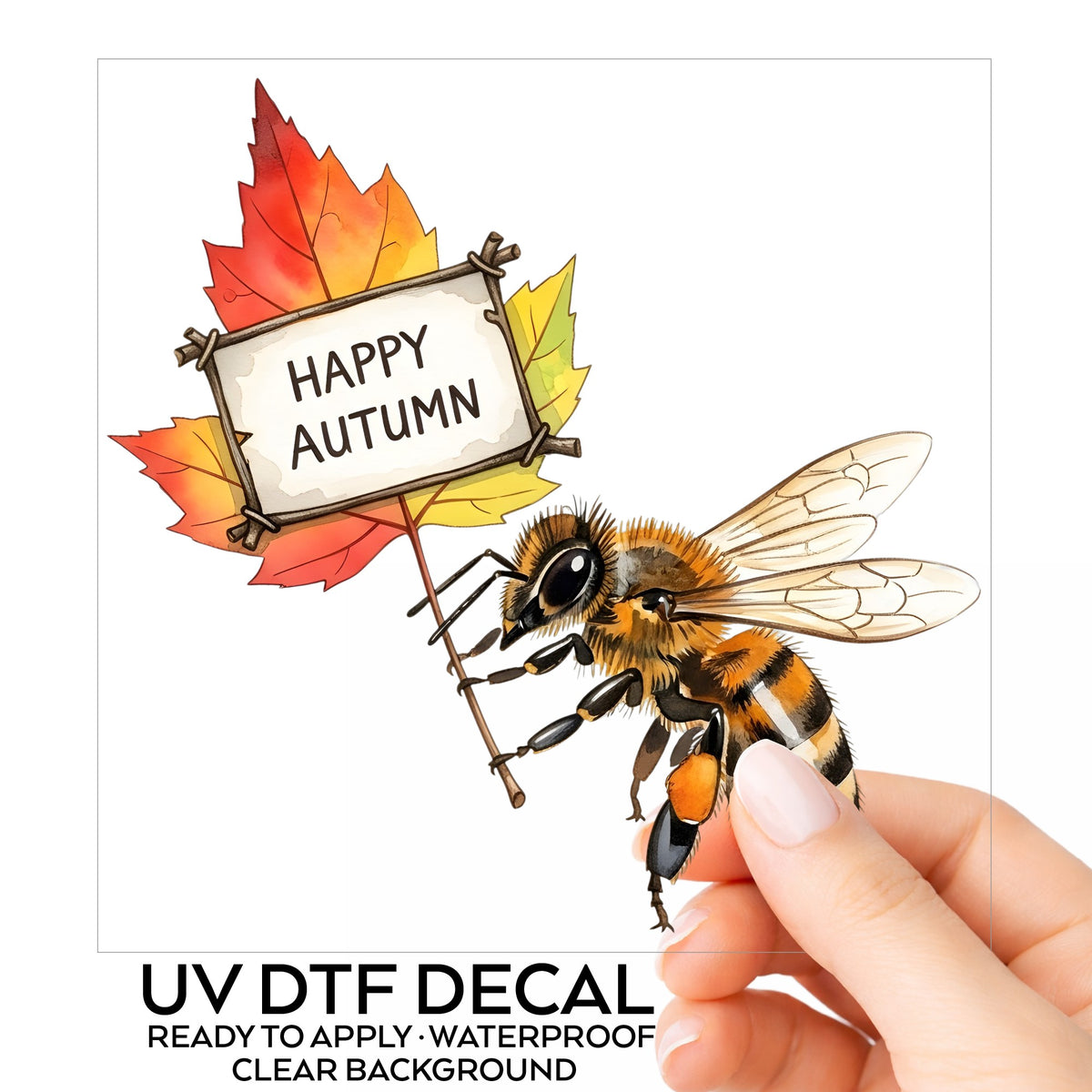 Honeybee Holding Happy Autumn Sign UV DTF sticker on its backing card, held in hand