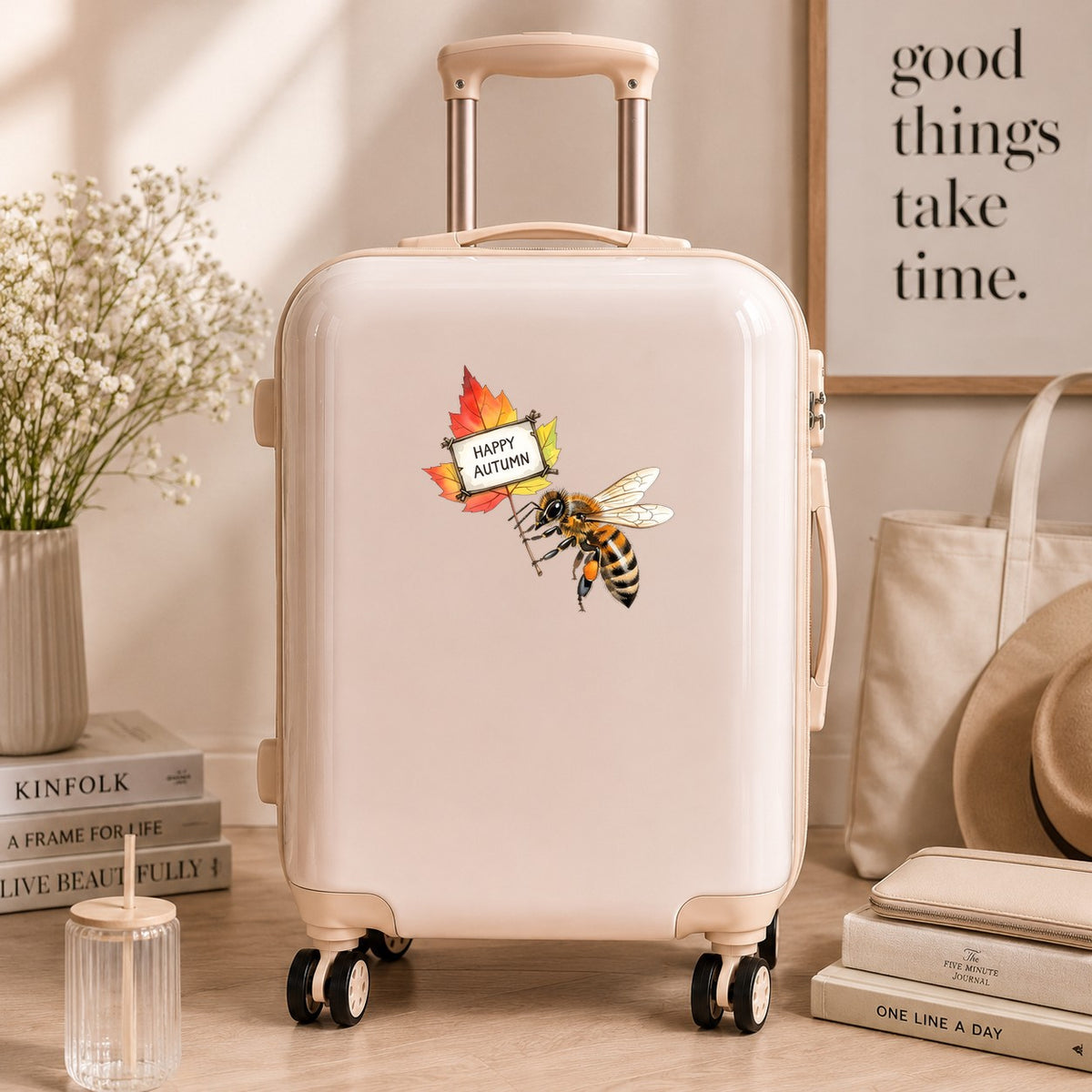 Honeybee Holding Happy Autumn Sign UV DTF sticker applied to a cream carry-on suitcase