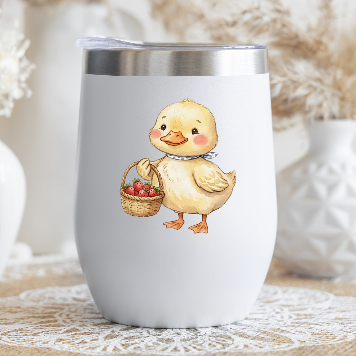 Duckling With Strawberry Basket UV DTF sticker applied to a white stemless tumbler with a lid