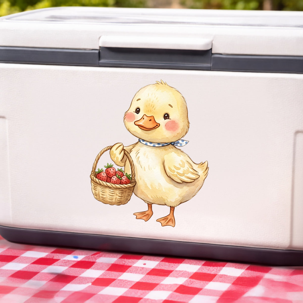 Duckling With Strawberry Basket UV DTF sticker applied to a white cooler on a red gingham cloth