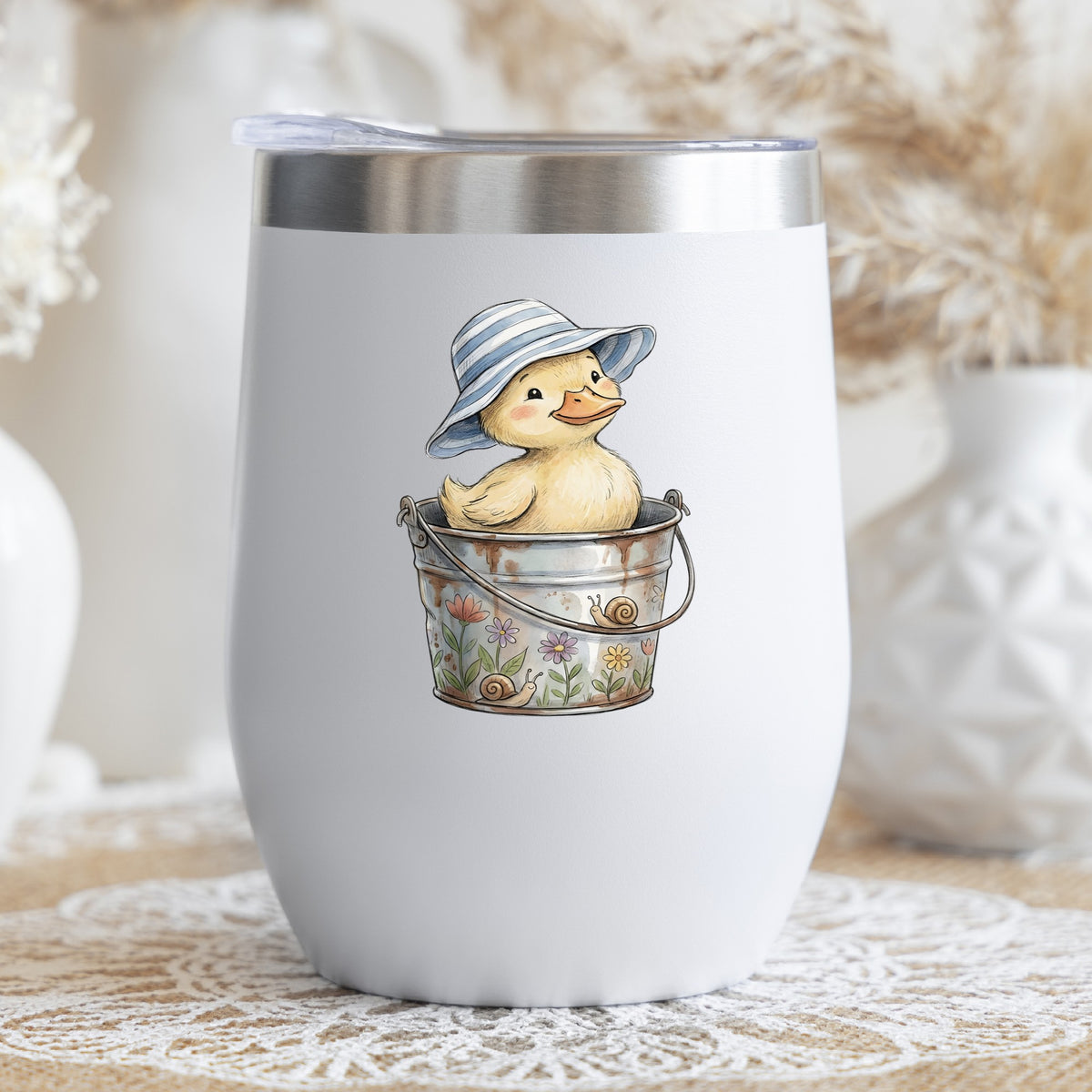 Duckling In Sun Hat In Bucket UV DTF sticker applied to a white stemless tumbler with a lid