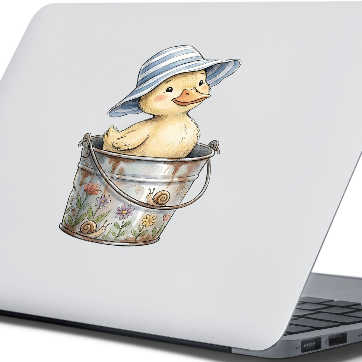 Duckling In Sun Hat In Bucket UV DTF sticker applied to the lid of a silver laptop