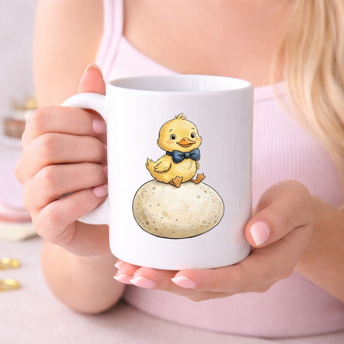Duckling On Giant Egg UV DTF sticker applied to a white coffee mug held in both hands