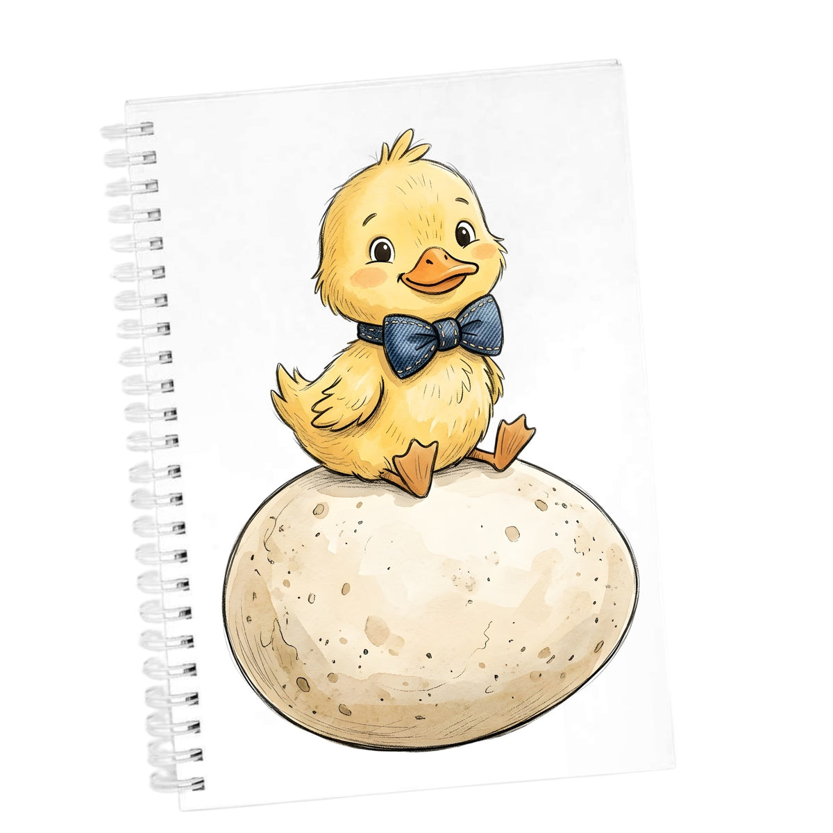 Duckling On Giant Egg UV DTF sticker applied to the cover of a white spiral journal