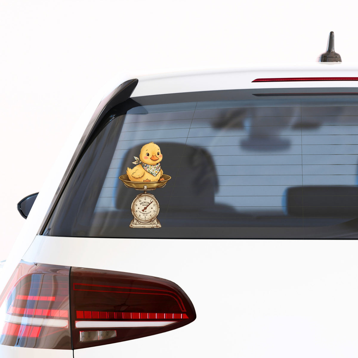 Duckling On Vintage Farm Scale UV DTF sticker applied to the rear window of a white car