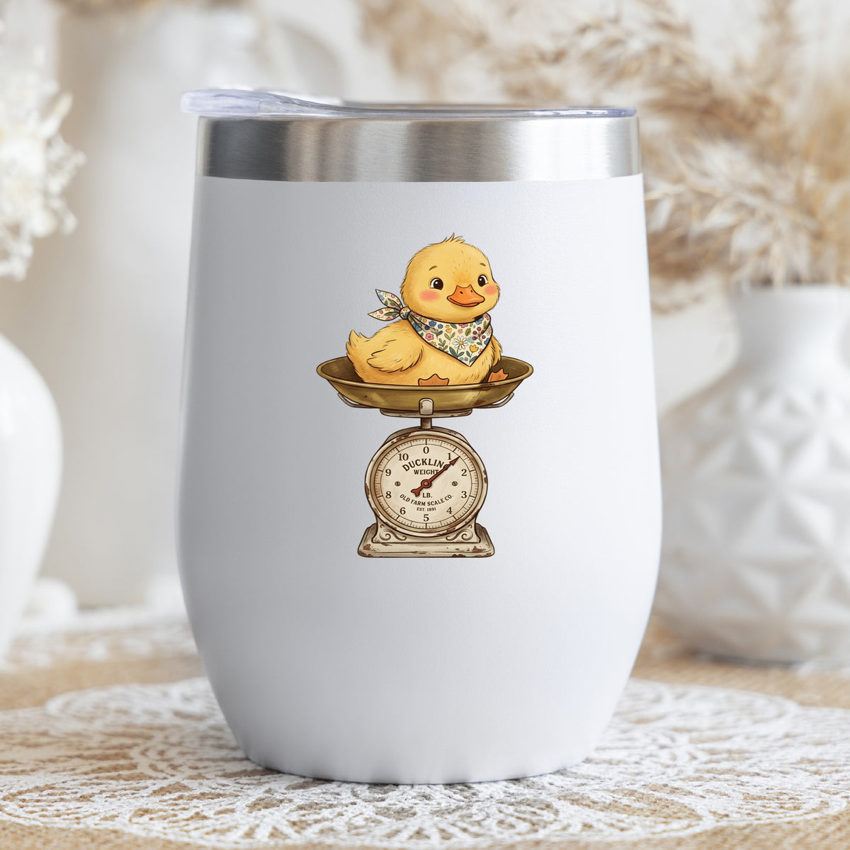Duckling On Vintage Farm Scale UV DTF sticker applied to a white stemless tumbler with a lid