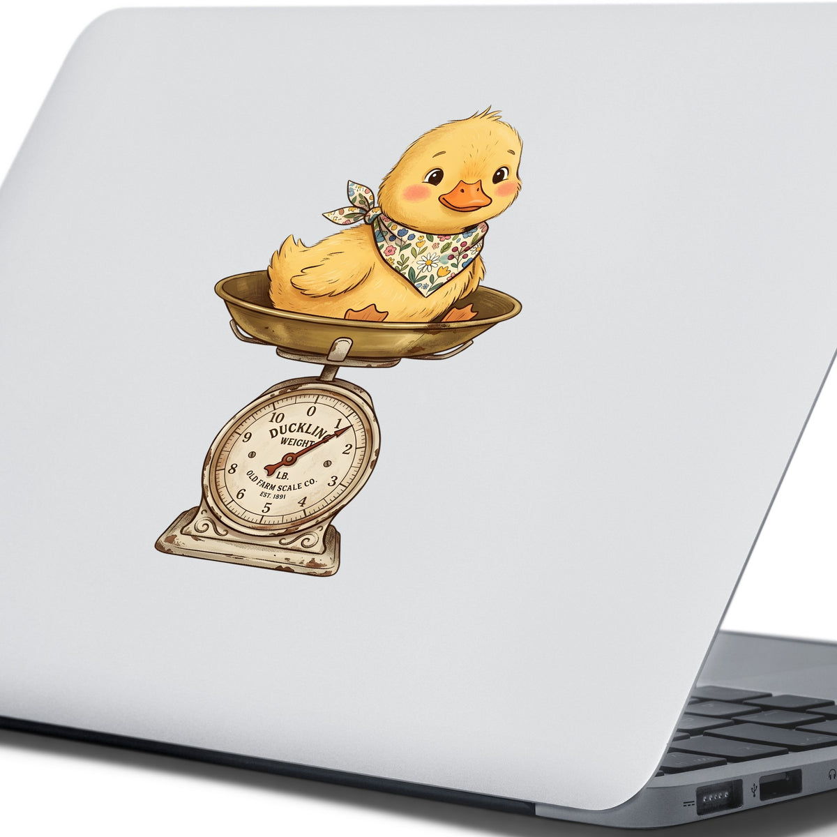Duckling On Vintage Farm Scale UV DTF sticker applied to the lid of a silver laptop