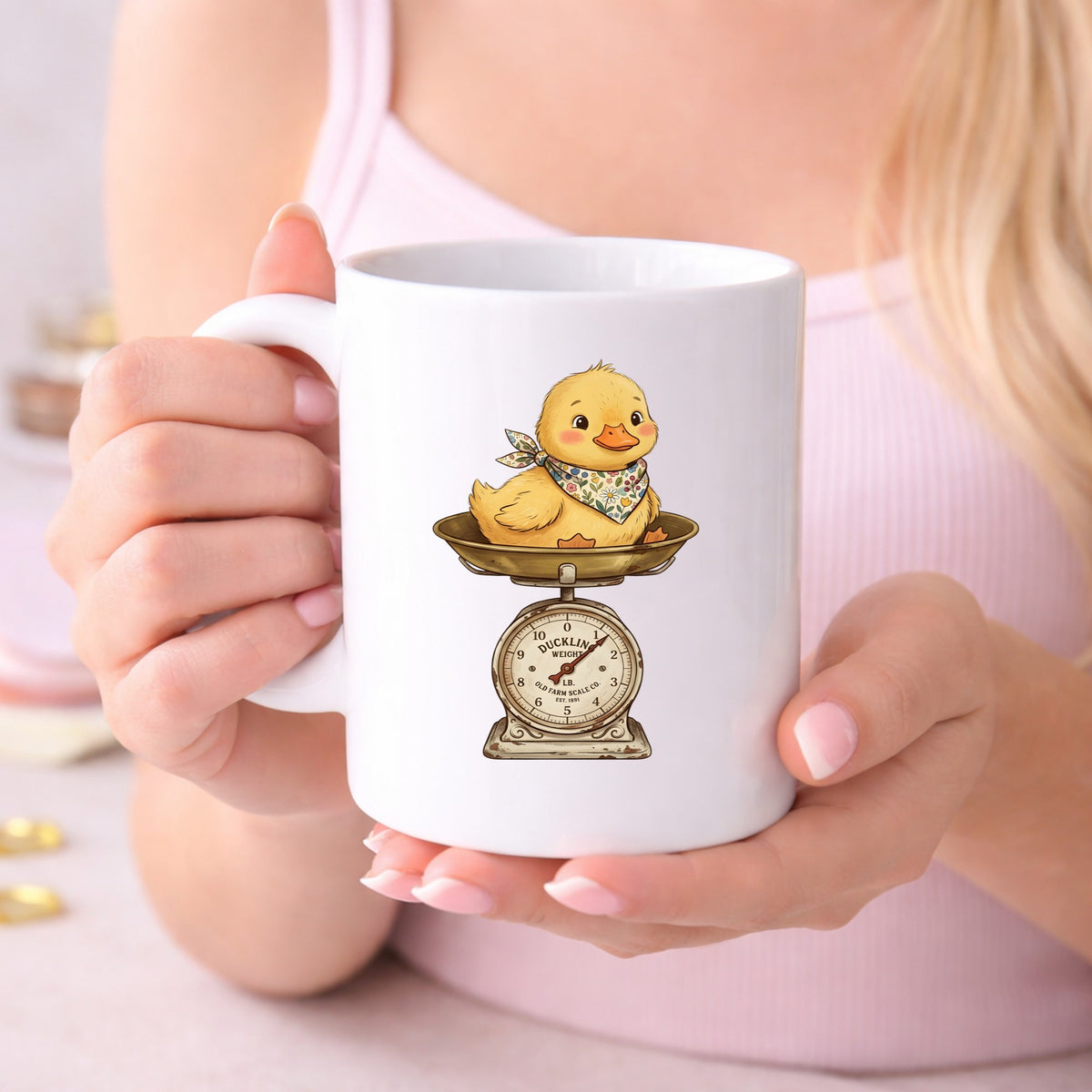 Duckling On Vintage Farm Scale UV DTF sticker applied to a white coffee mug held in both hands