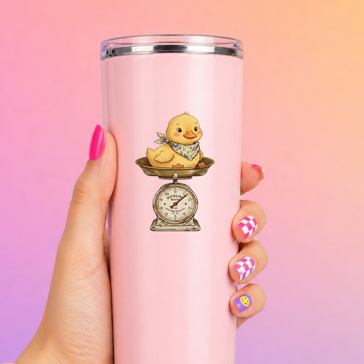 Duckling On Vintage Farm Scale UV DTF sticker applied to a tall pink tumbler on a pink and orange background