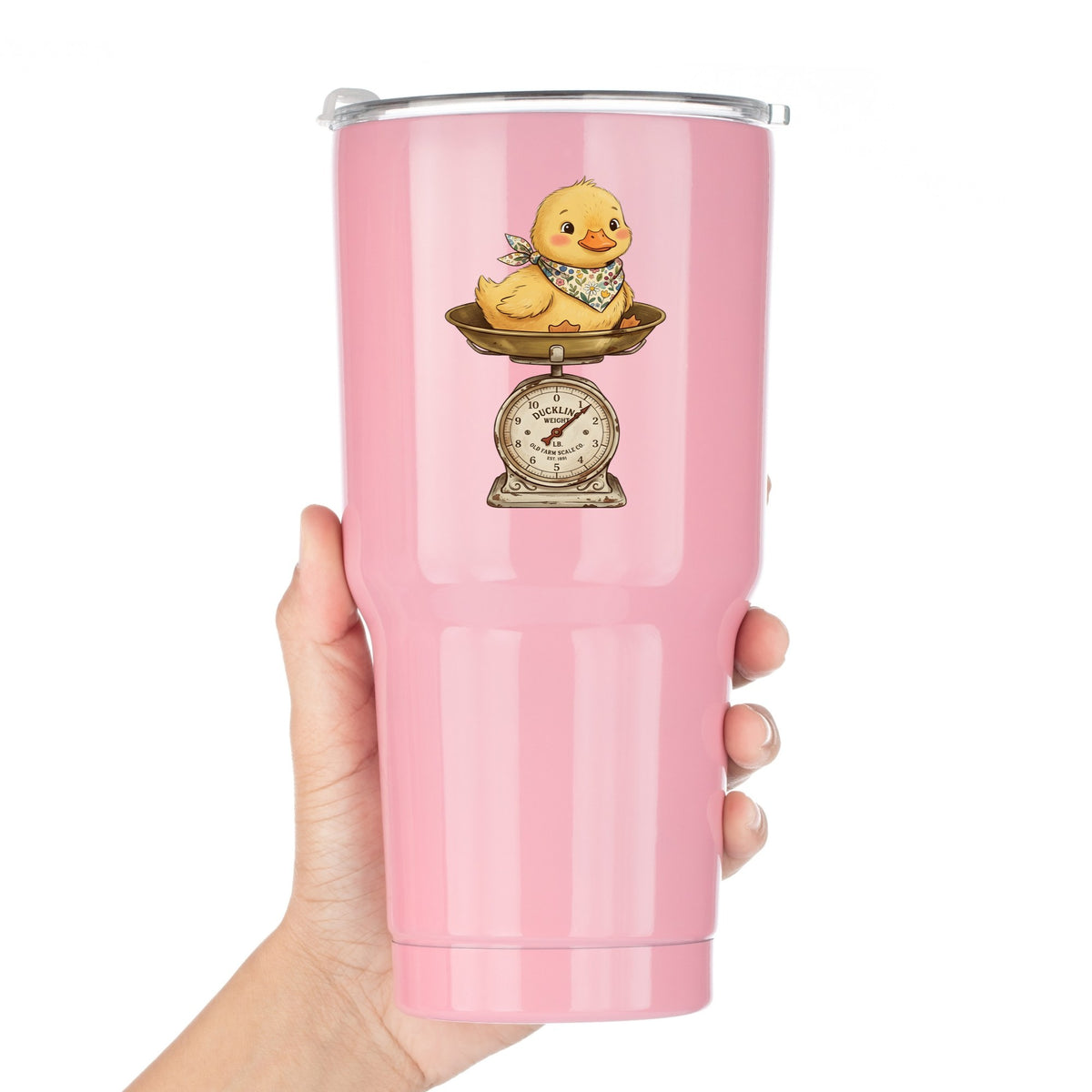 Duckling On Vintage Farm Scale UV DTF sticker applied to a pink tumbler held against a white background