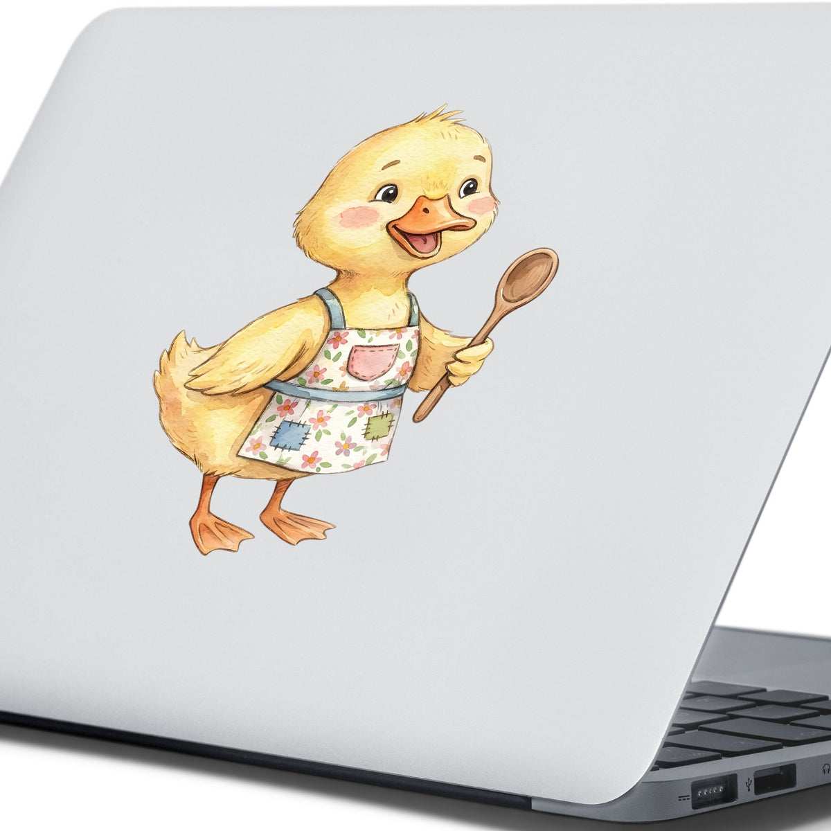 Duckling In Apron With Wooden Spoon UV DTF sticker applied to the lid of a silver laptop