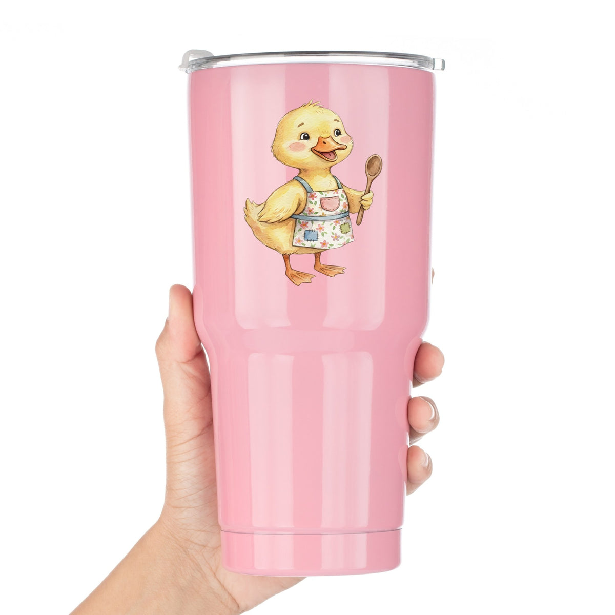 Duckling In Apron With Wooden Spoon UV DTF sticker applied to a pink tumbler held against a white background