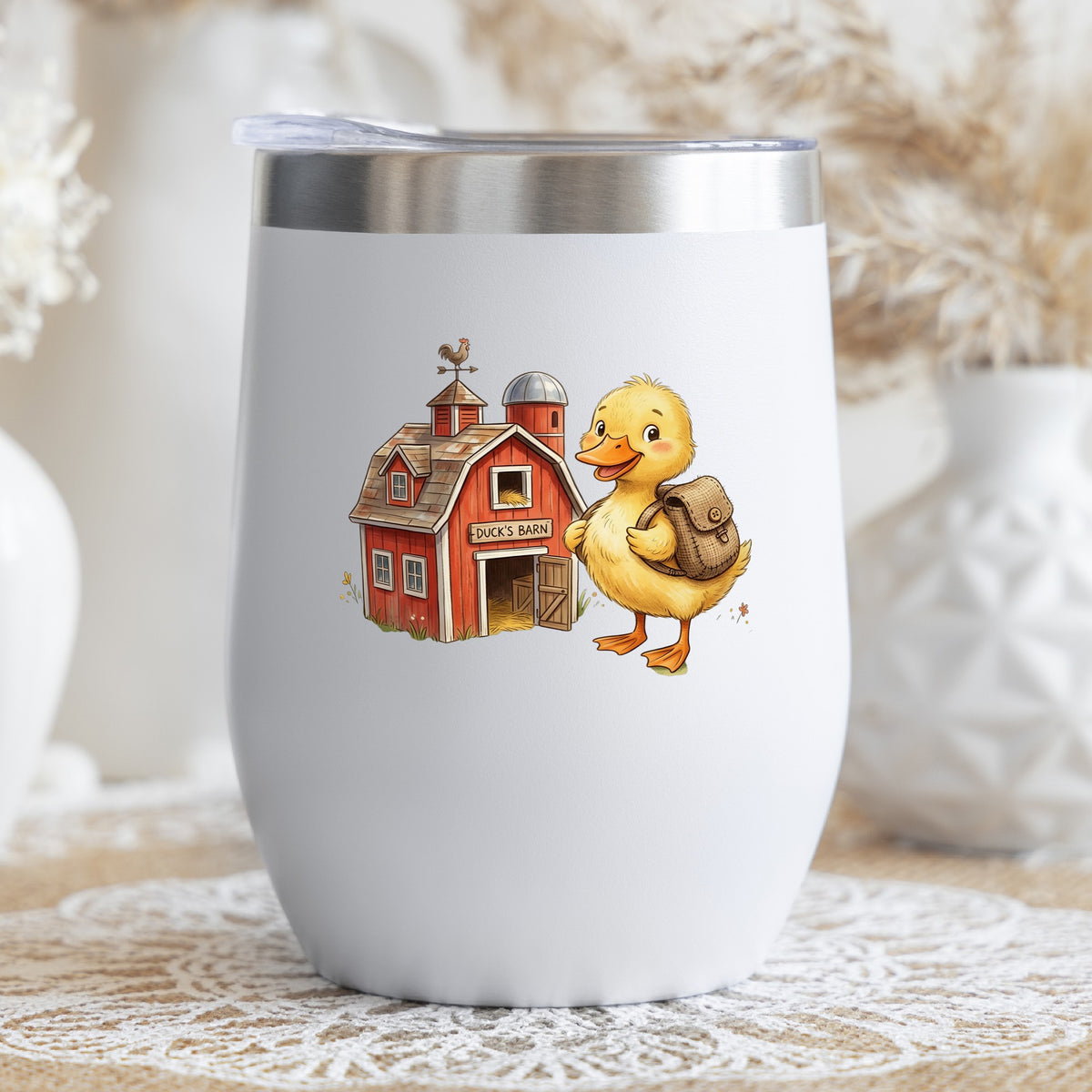 Duckling With Backpack And Red Barn UV DTF sticker applied to a white stemless tumbler with a lid