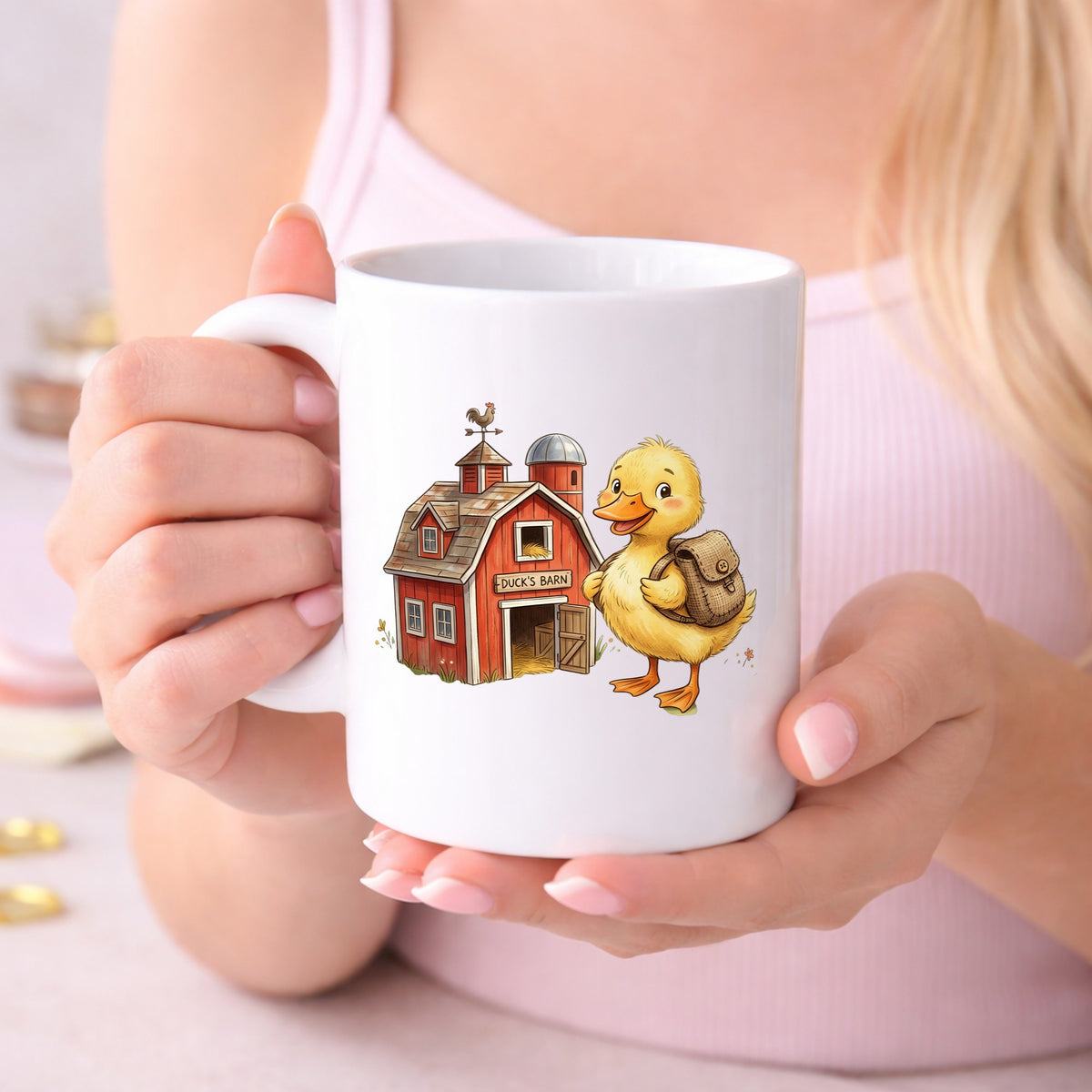 Duckling With Backpack And Red Barn UV DTF sticker applied to a white coffee mug held in both hands