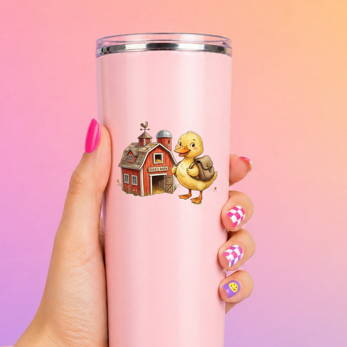 Duckling With Backpack And Red Barn UV DTF sticker applied to a tall pink tumbler on a pink and orange background