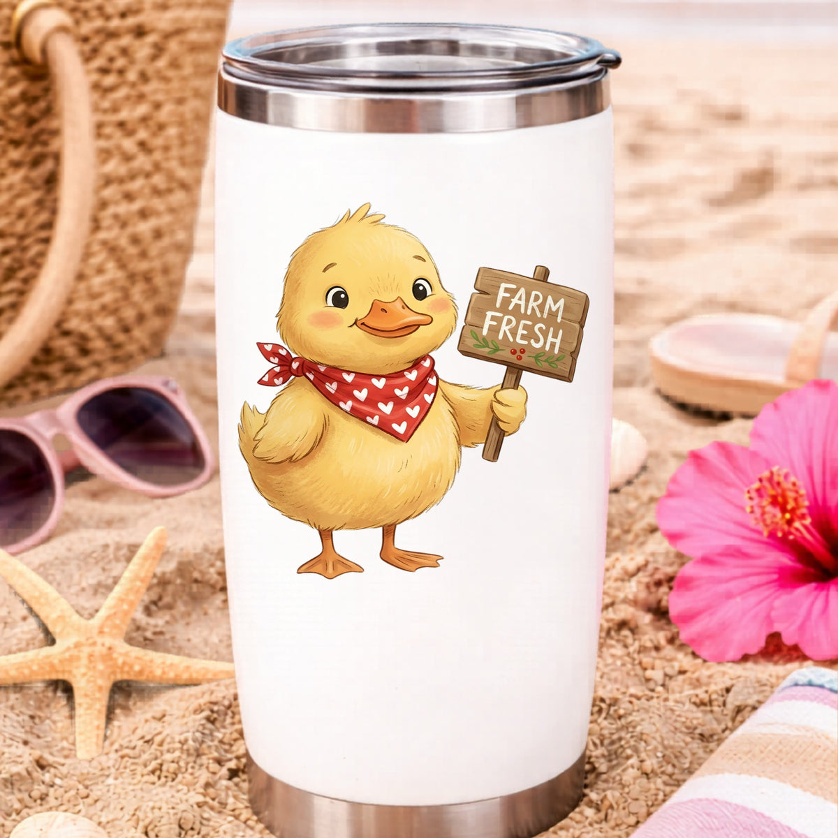 Duckling With Farm Fresh Sign UV DTF sticker applied to a white travel tumbler on beach sand