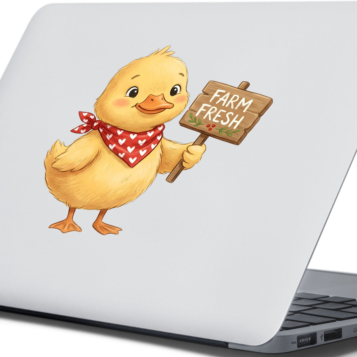 Duckling With Farm Fresh Sign UV DTF sticker applied to the lid of a silver laptop