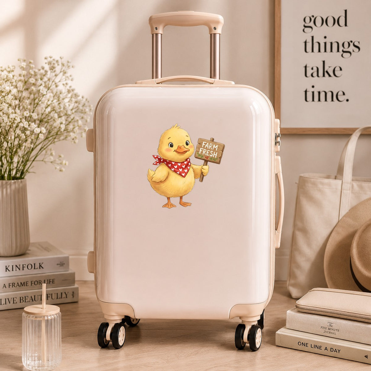 Duckling With Farm Fresh Sign UV DTF sticker applied to a cream carry-on suitcase