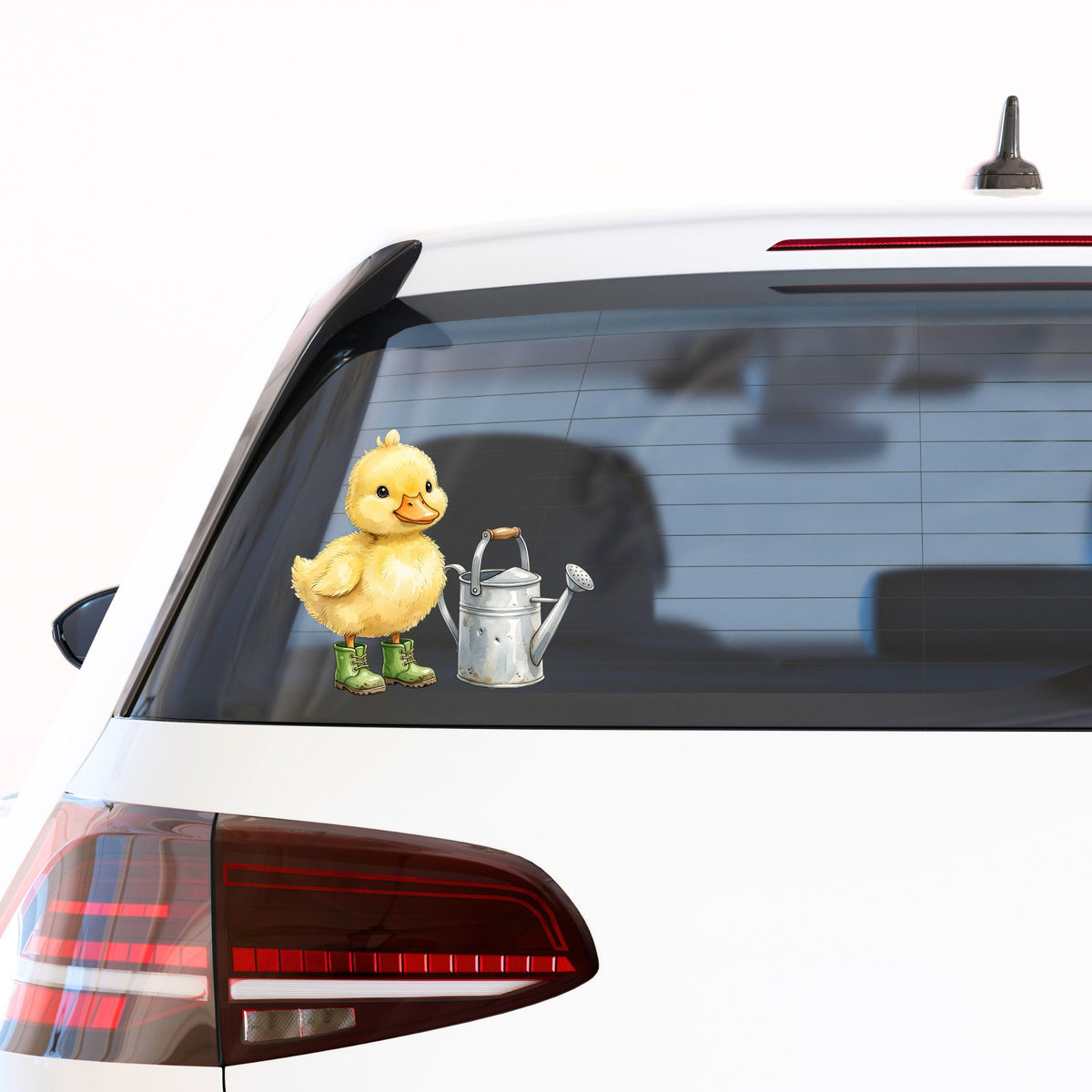 Duckling In Boots With Watering Can UV DTF sticker applied to the rear window of a white car