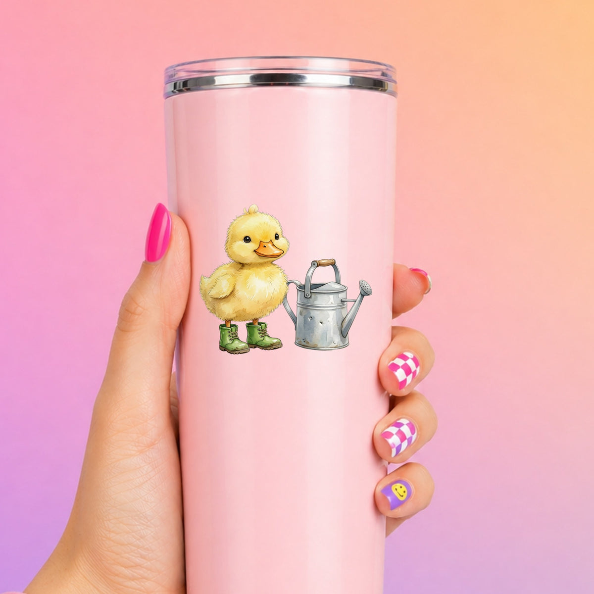 Duckling In Boots With Watering Can UV DTF sticker applied to a tall pink tumbler on a pink and orange background