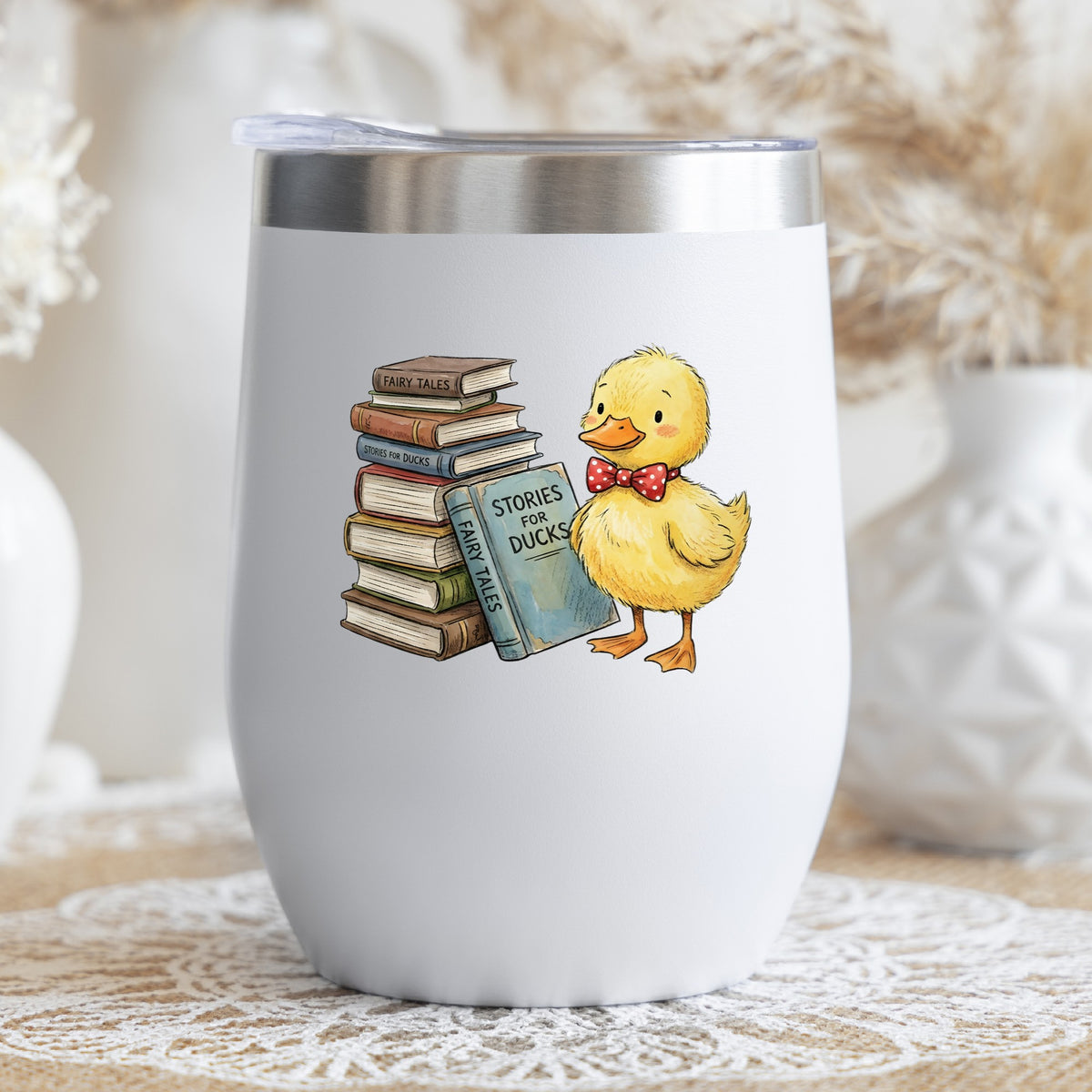 Duckling With Stack Of Storybooks UV DTF sticker applied to a white stemless tumbler with a lid