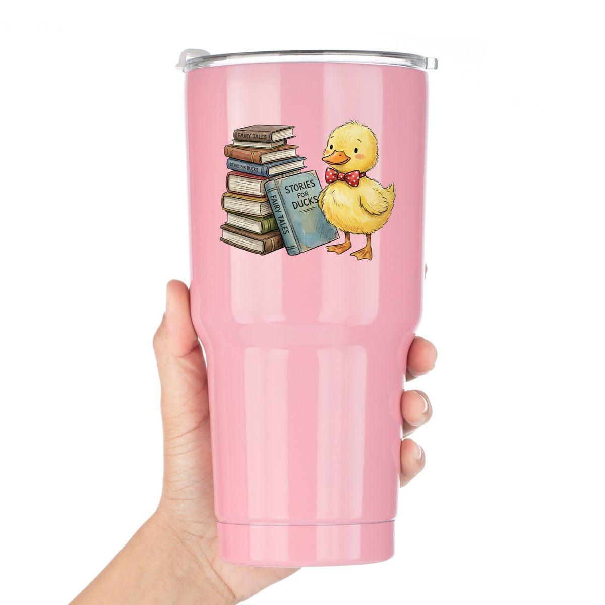 Duckling With Stack Of Storybooks UV DTF sticker applied to a pink tumbler held against a white background