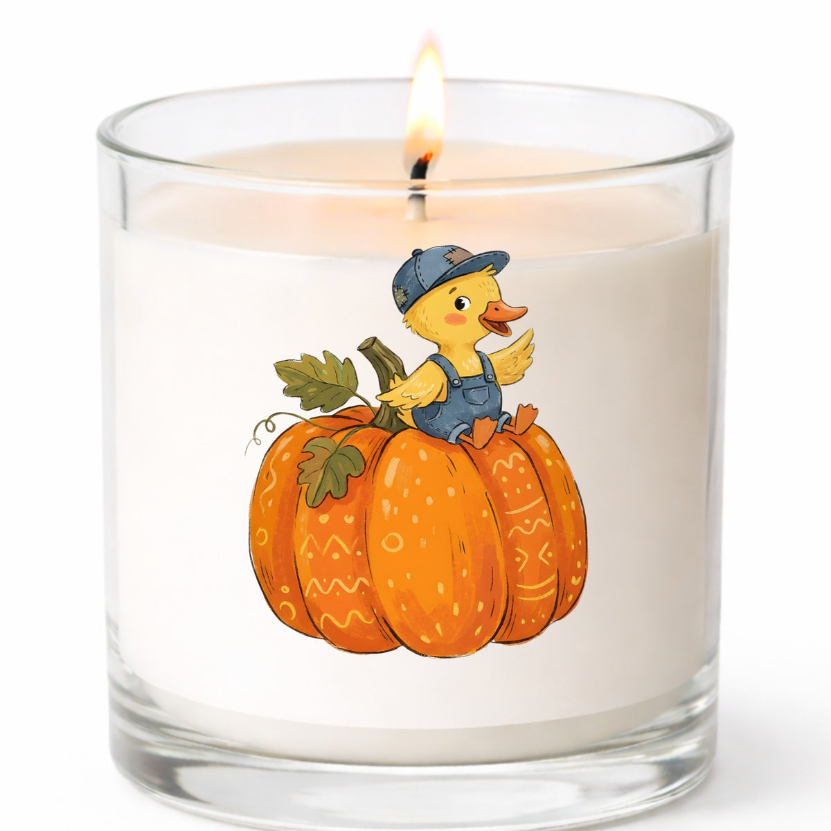 Duckling In Overalls On Pumpkin UV DTF sticker applied to a white candle in a clear glass jar