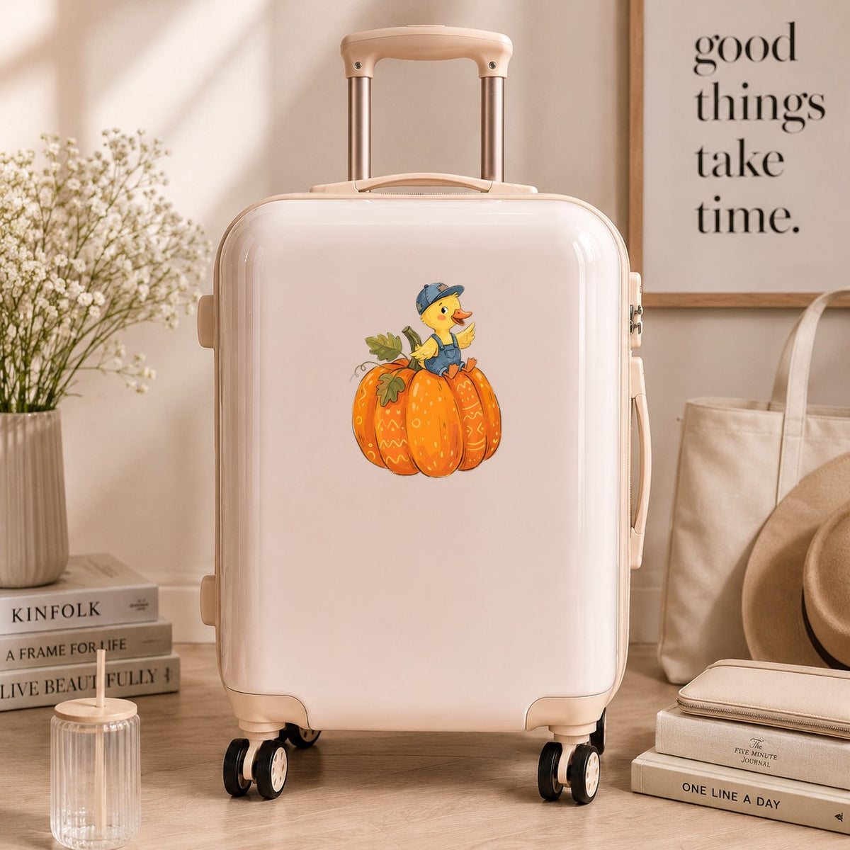 Duckling In Overalls On Pumpkin UV DTF sticker applied to a cream carry-on suitcase