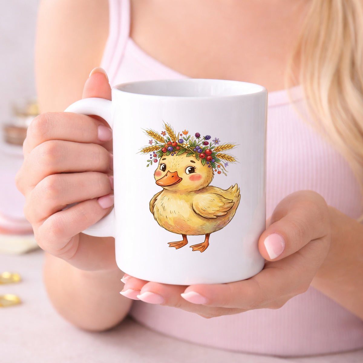 Duckling With Wheat And Berry Crown UV DTF sticker applied to a white coffee mug held in both hands