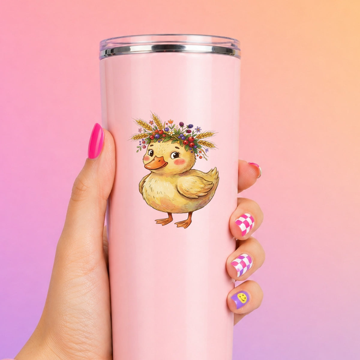 Duckling With Wheat And Berry Crown UV DTF sticker applied to a tall pink tumbler on a pink and orange background