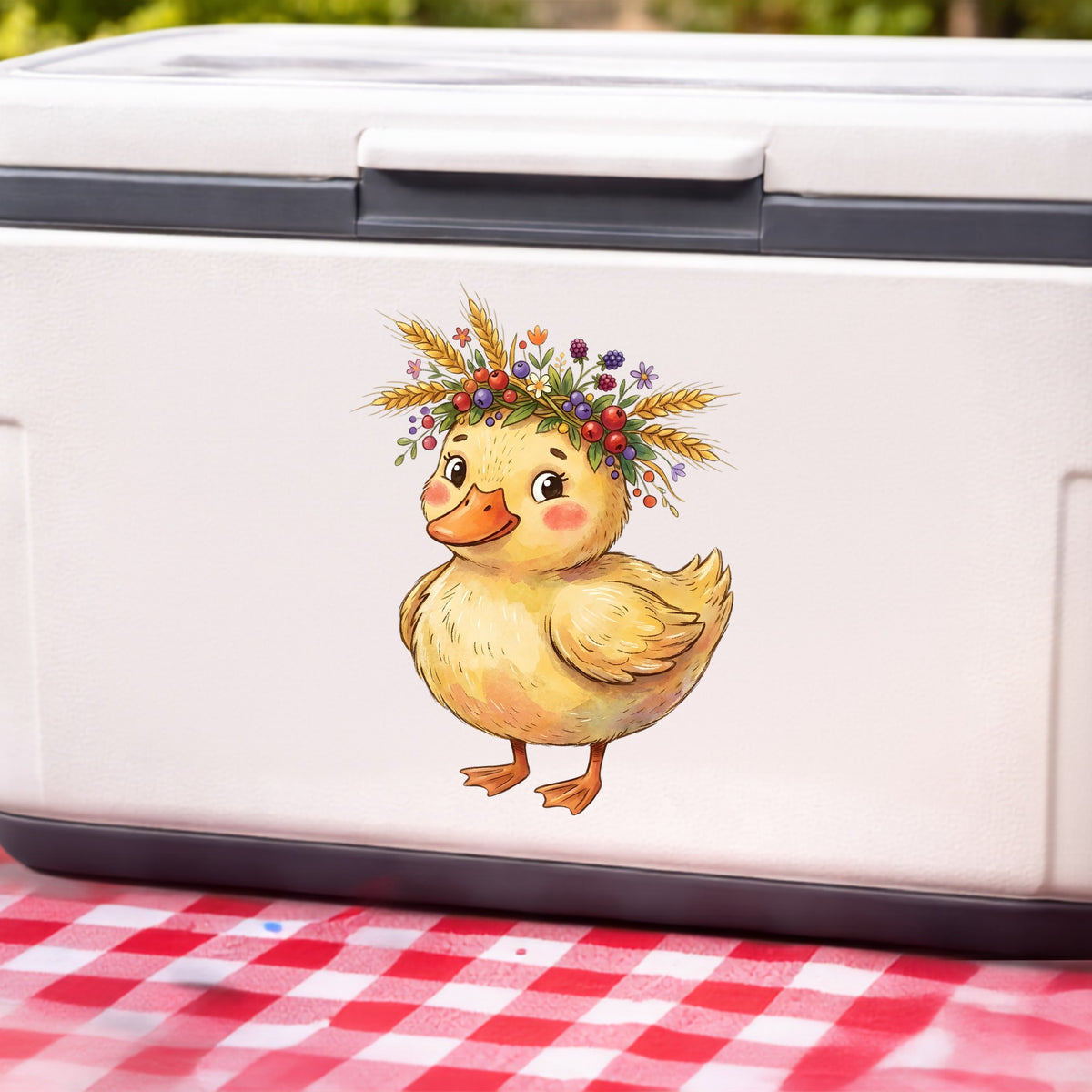 Duckling With Wheat And Berry Crown UV DTF sticker applied to a white cooler on a red gingham cloth
