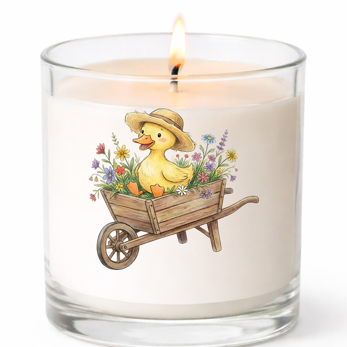 Duckling In Wheelbarrow Of Flowers UV DTF sticker applied to a white candle in a clear glass jar