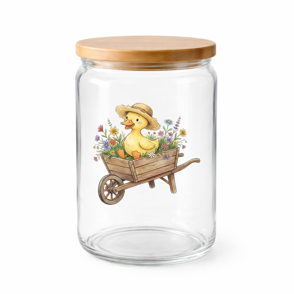 Duckling In Wheelbarrow Of Flowers UV DTF sticker applied to a clear glass jar with a wooden lid