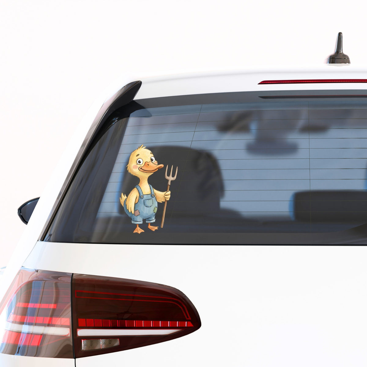 Duck In Overalls Holding Pitchfork UV DTF sticker applied to the rear window of a white car