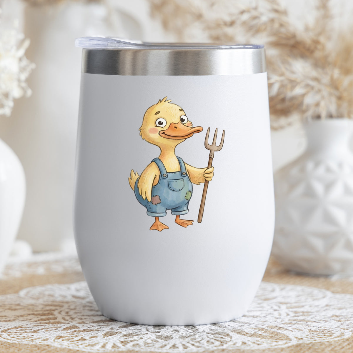 Duck In Overalls Holding Pitchfork UV DTF sticker applied to a white stemless tumbler with a lid