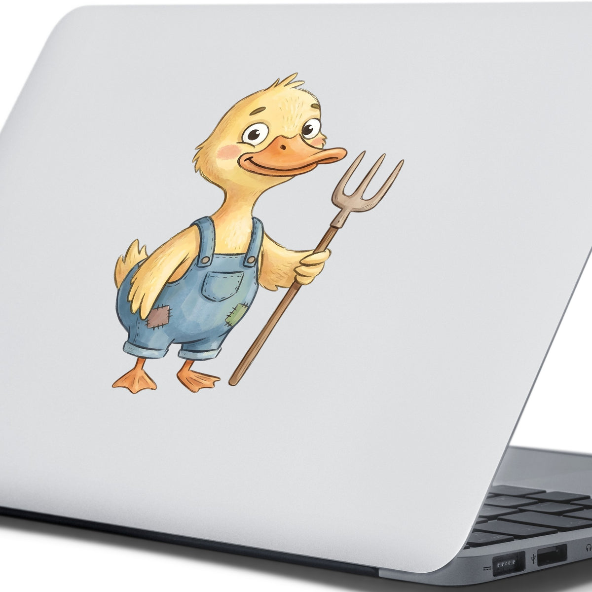 Duck In Overalls Holding Pitchfork UV DTF sticker applied to the lid of a silver laptop