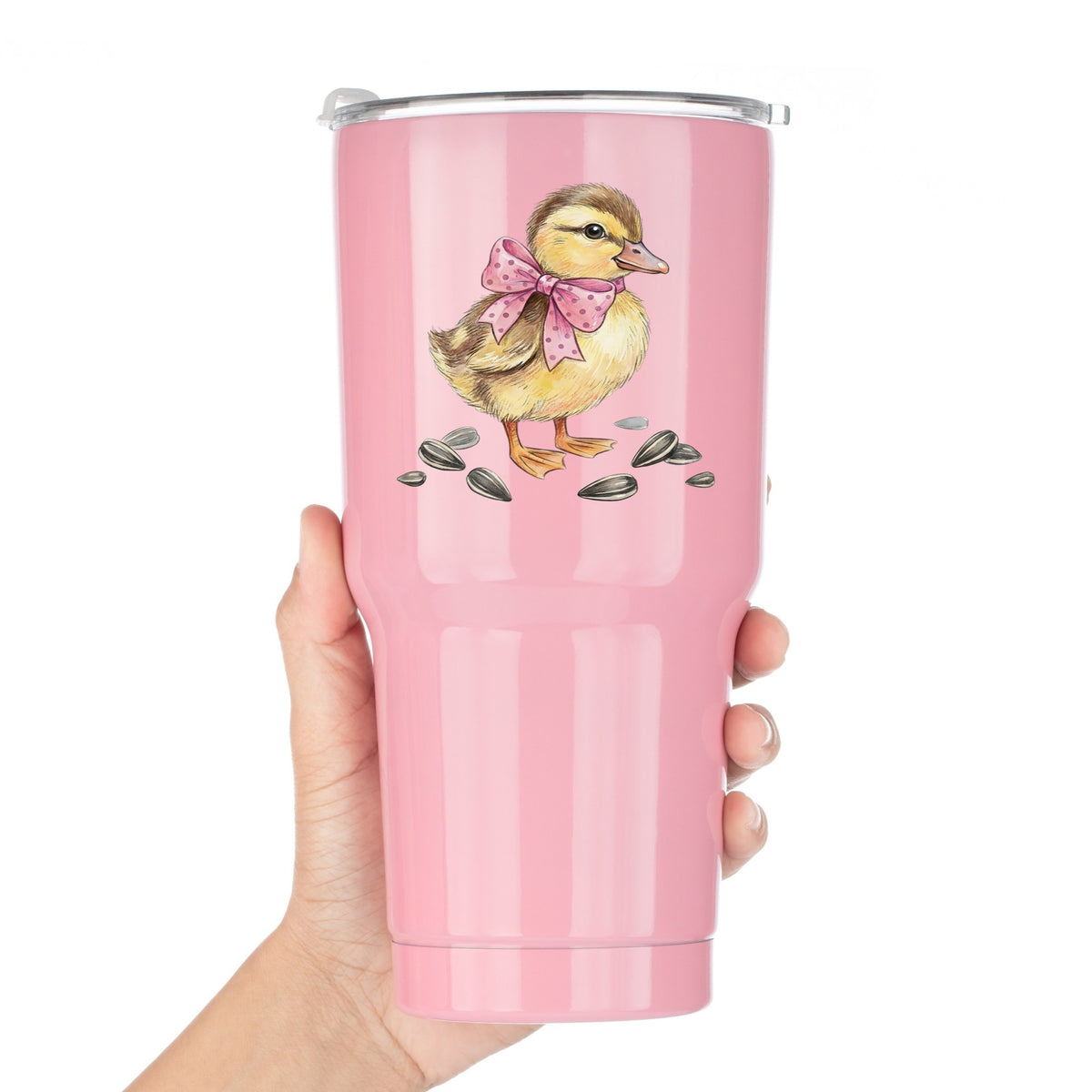 Brown Duckling With Pink Bow UV DTF sticker applied to a pink tumbler held against a white background