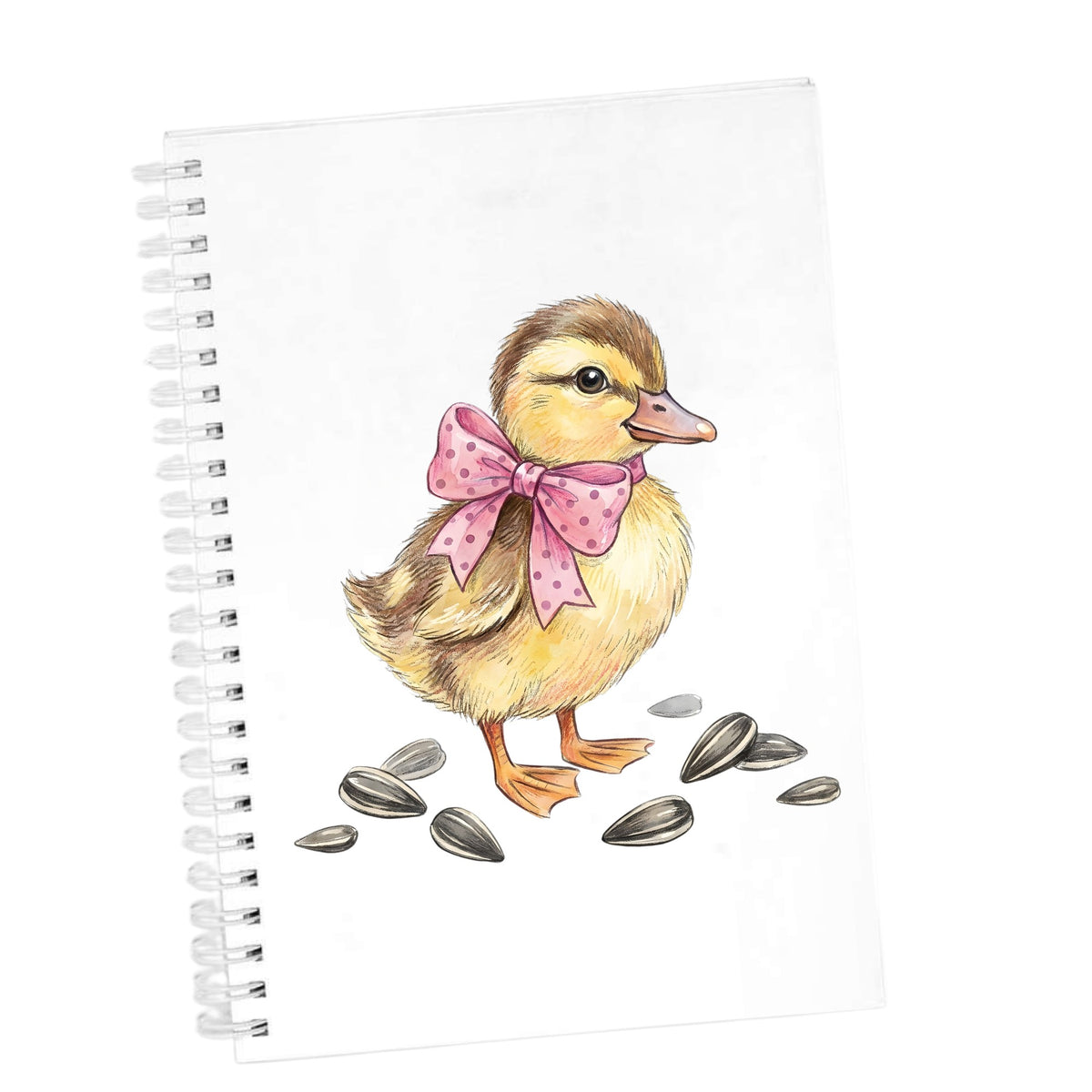 Brown Duckling With Pink Bow UV DTF sticker applied to the cover of a white spiral journal