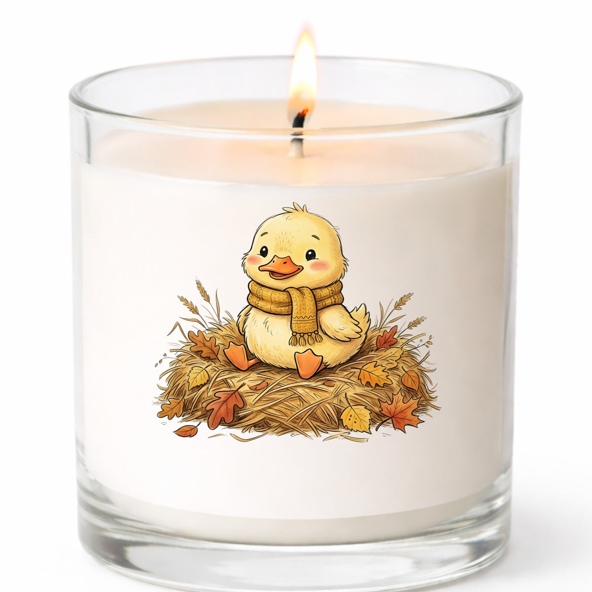 Duckling In Scarf On Hay With Autumn Leaves UV DTF sticker applied to a white candle in a clear glass jar