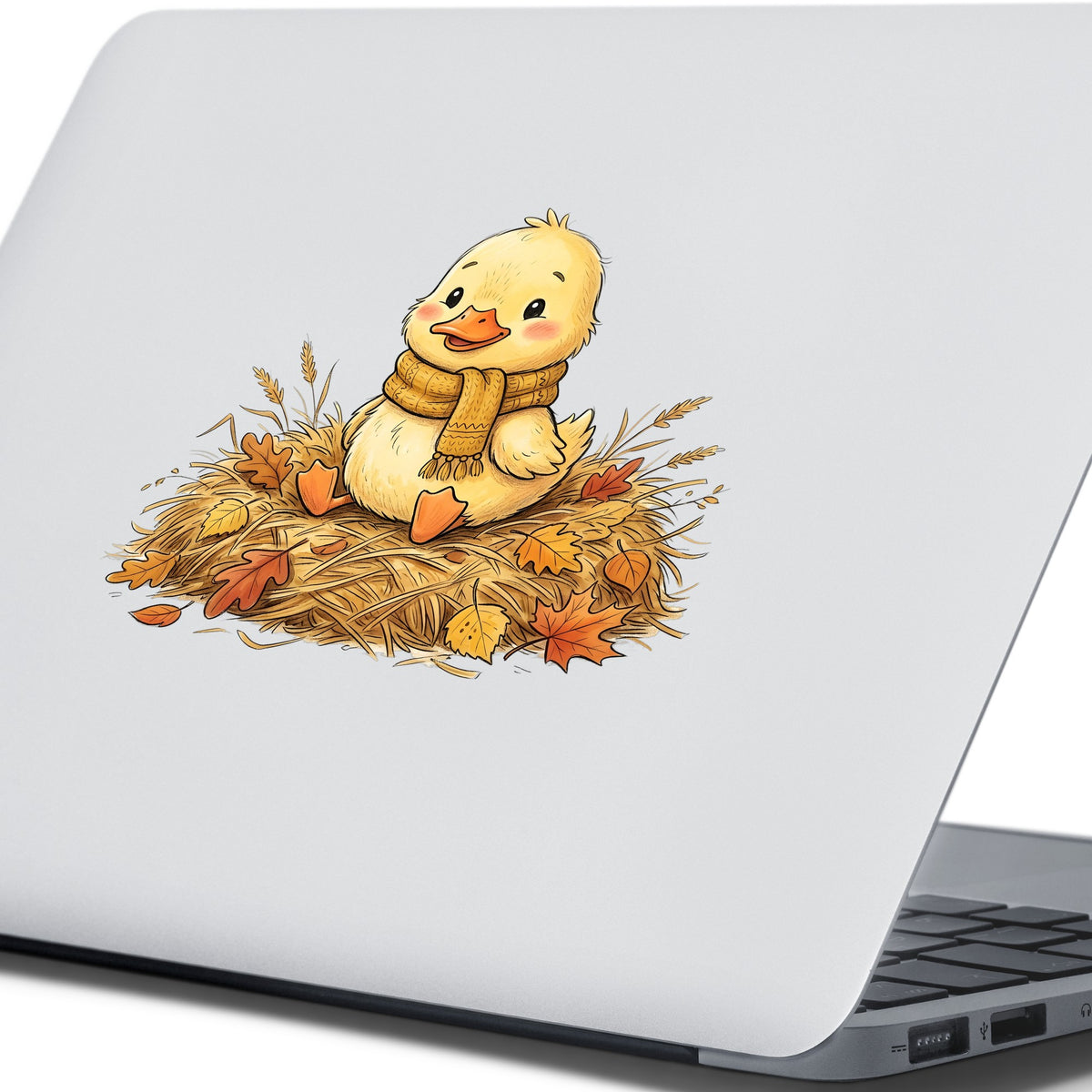 Duckling In Scarf On Hay With Autumn Leaves UV DTF sticker applied to the lid of a silver laptop