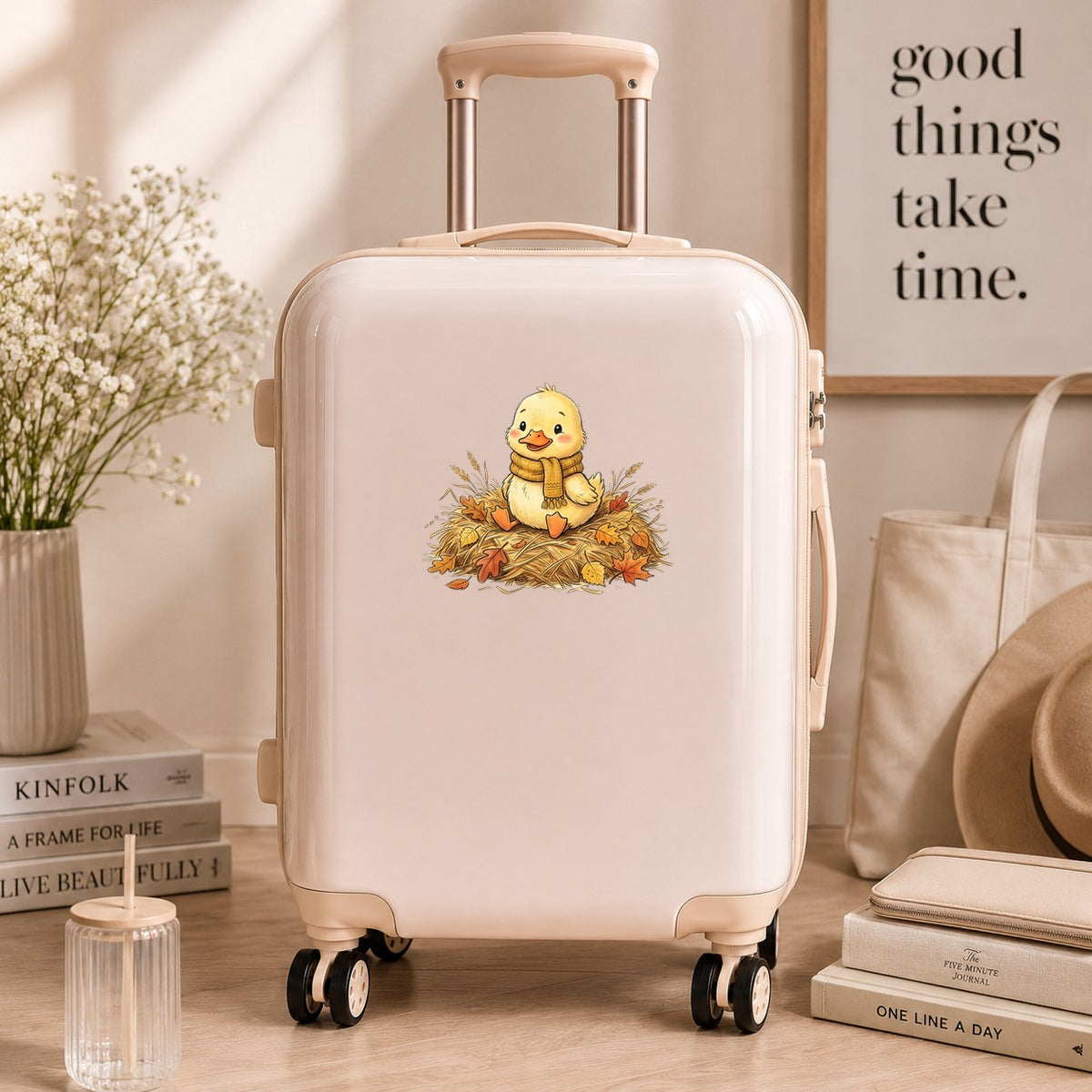 Duckling In Scarf On Hay With Autumn Leaves UV DTF sticker applied to a cream carry-on suitcase