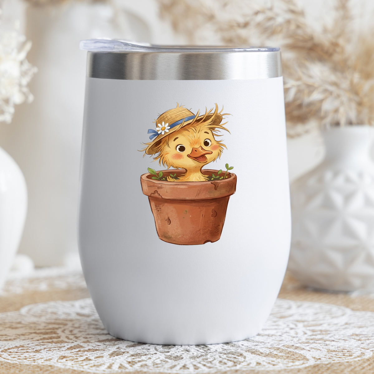 Fluffy Duckling In Flower Pot UV DTF sticker applied to a white stemless tumbler with a lid