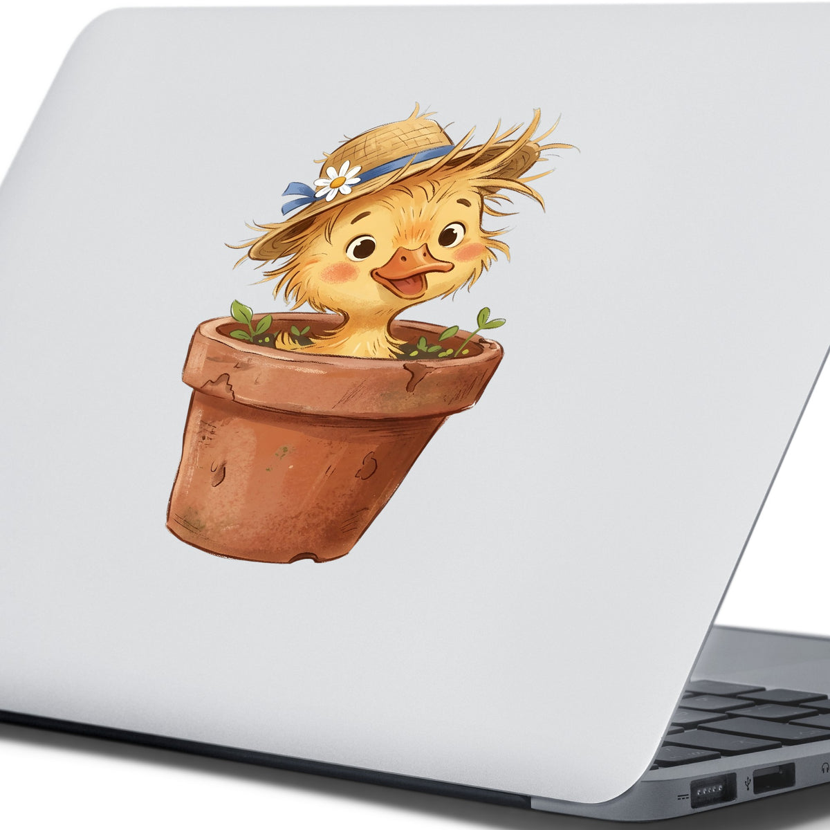 Fluffy Duckling In Flower Pot UV DTF sticker applied to the lid of a silver laptop