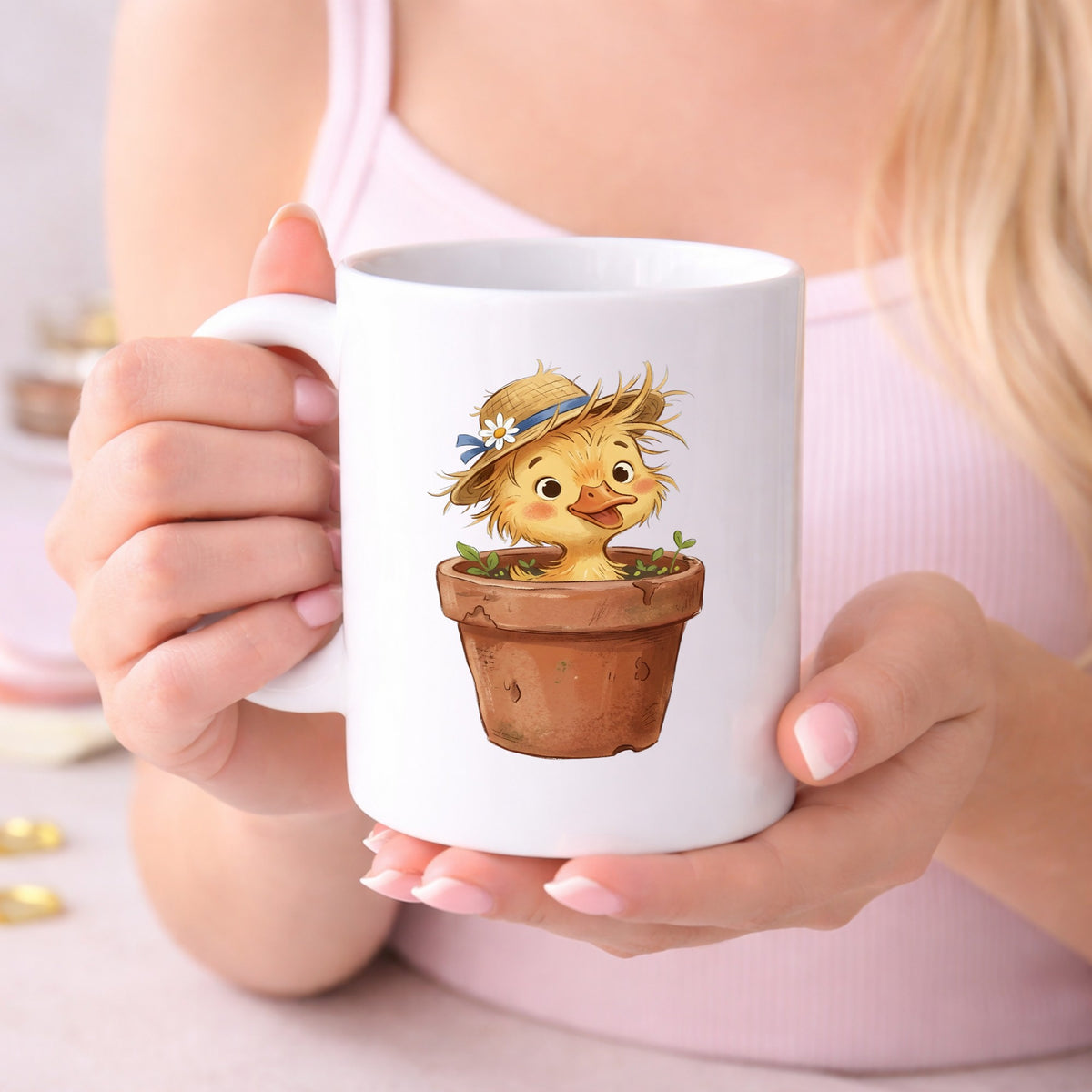Fluffy Duckling In Flower Pot UV DTF sticker applied to a white coffee mug held in both hands