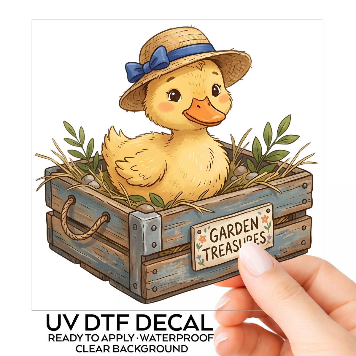 Duckling In Garden Treasures Crate UV DTF sticker on its backing card, held in hand