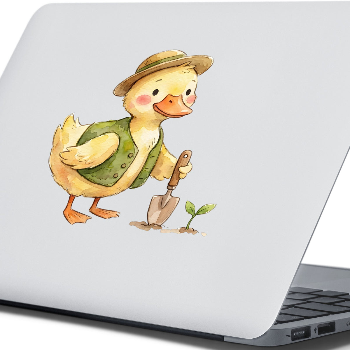 Duck In Green Vest With Garden Trowel UV DTF sticker applied to the lid of a silver laptop